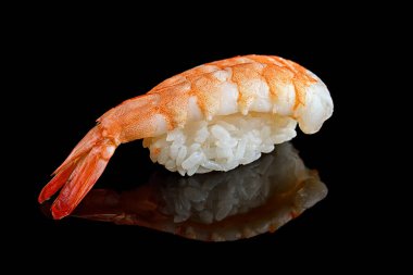 Ebi sushi with tiger shrimp, on a black mirror