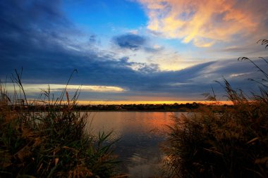 Calm, peaceful evening on the shore of the lake