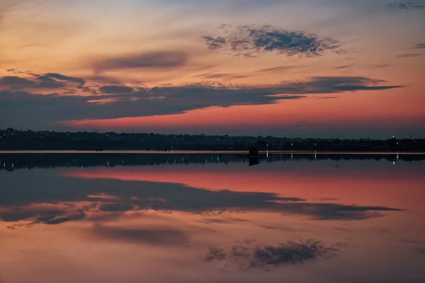 stock image Beautiful sunset with clouds and water in the foreground