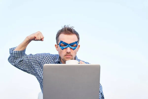 Caucasian Man Nightwear Shirt Superhero Blue Mask Using Laptop Showing — Zdjęcie stockowe