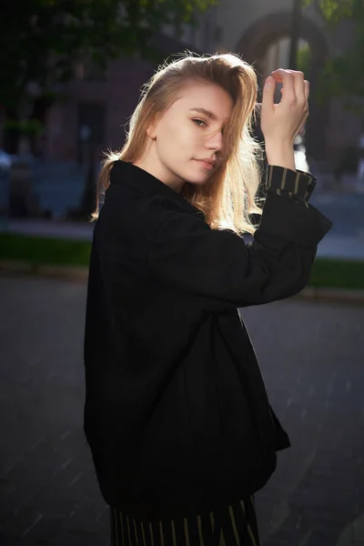 smiling natural looking beauty teenage girl with blond hair outdoor on the sunset. Looking at the camera .High quality photo
