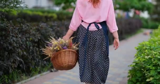 Farm Woman Walking Apron Basket Dried Flowers Outdoor Village Life — Stock Video