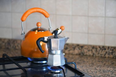 Gas stove with kettle and moka pot