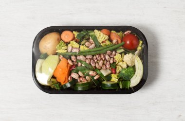 Plastic package with vegetables , ingredients for italian soup minestrone