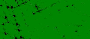 Bir sürü siyah noktalı yeşil bir ekran.