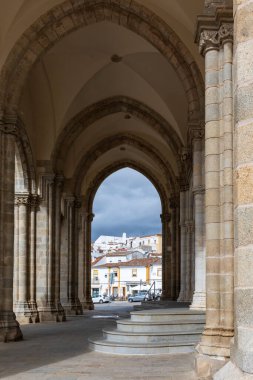 Street view of an ancient City of Evora in Portugal clipart