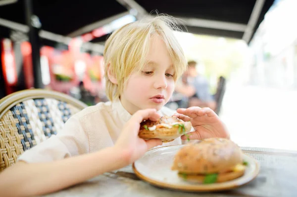 Cute Blonde Boy Eating Large Bagel Salmon Arugula Outdoor Fast — Stock Photo, Image