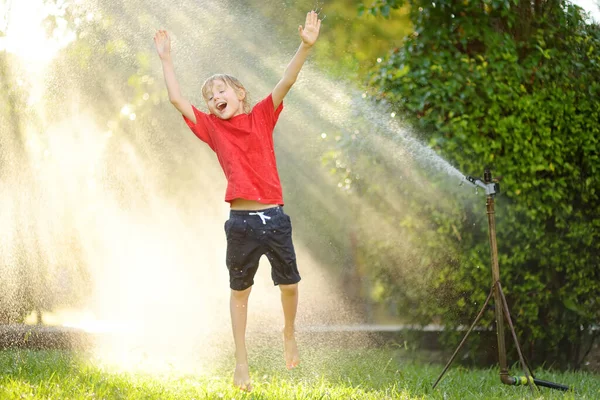 Funny Little Boy Playing Garden Sprinkler Sunny City Park Elementary — Photo