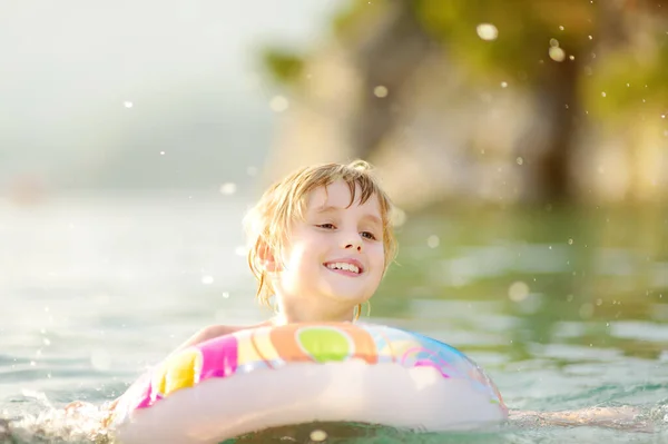 Little Boy Swimming Colorful Floating Ring Sea Sunny Summer Day — Foto de Stock