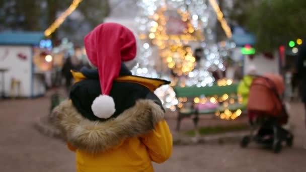 Cute Preteen Boy Santa Claus Hat Visiting Outdoors Festive Town — Stock Video