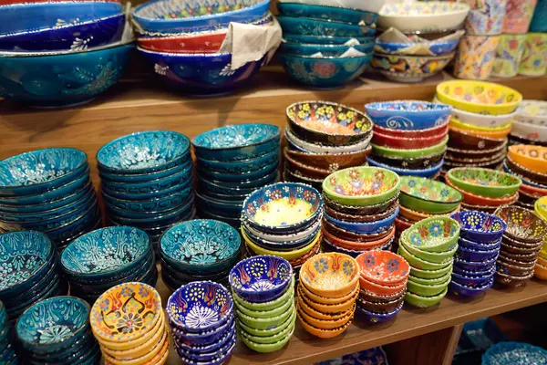Sale of traditional colorful Turkish ceramics dishes in the Istanbul Grand Bazaar, Istanbul. Authentic gifts, keepsakes and souvenirs from travels in Turkey.