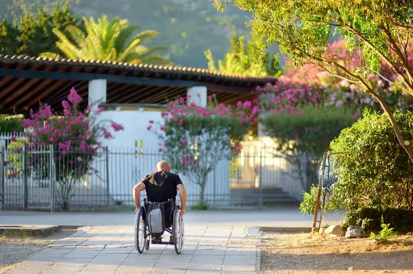 Budva Montenegro July 2023 Man Wheelchair Ride Footpath Resort Town Imágenes de stock libres de derechos