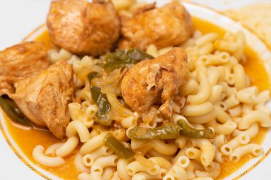 Tasty pasta and chicken breast with sauce on dish