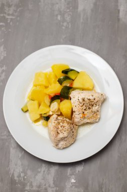 Clean food, Boiled chicken breasts with vegetables on white plate.