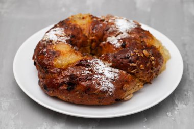 typical portuguese fruit cake Bolo rainha on white plate