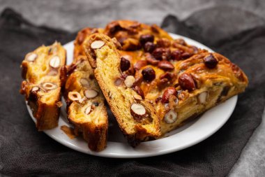 typical portuguese fruit cake Bolo rainha on white plate