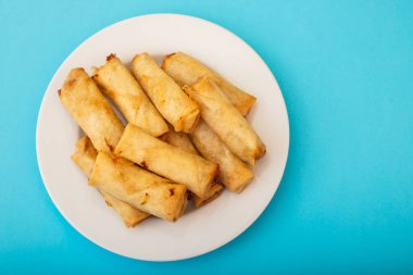 Spring Roll also known as Egg Roll on white small dish