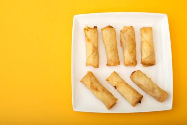 Spring Roll also known as Egg Roll on white small dish