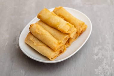 Spring Roll also known as Egg Roll on white small dish