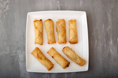 Spring Roll also known as Egg Roll on white small dish