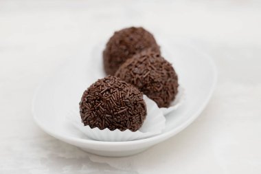 Goumert egg chocolate sweets tradition in Brazil on white dish.