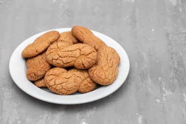 White plate with tea cookie letter S typical in Portugal