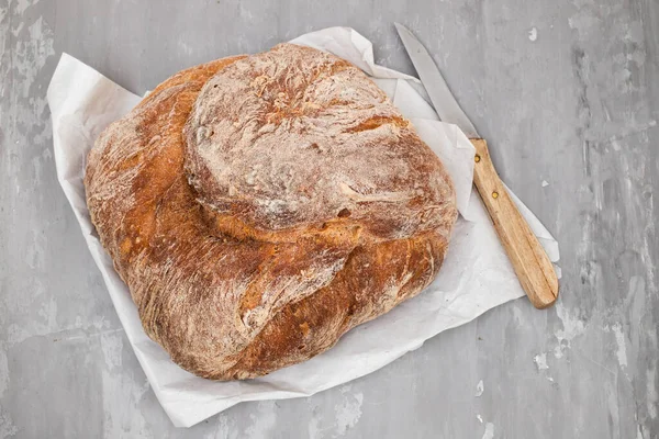 stock image Fresh bread with cereals on gray ceramic background