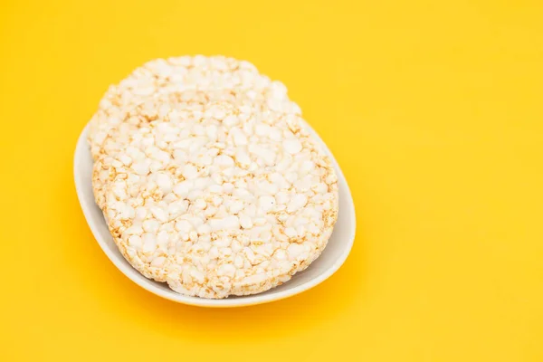 Stock image Few crunchy rice cakes on white small dish