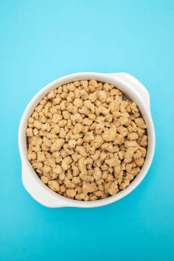 dry uncooked soya in white small bowl on ceramic