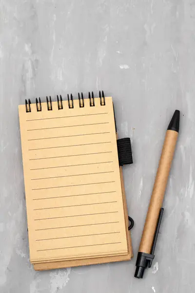 school notebook on a ceramic background, spiral notepad