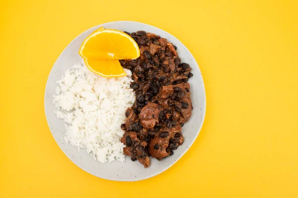 Feijoada typical Brazilian food. Traditional Brazilian food made with black beans in plate