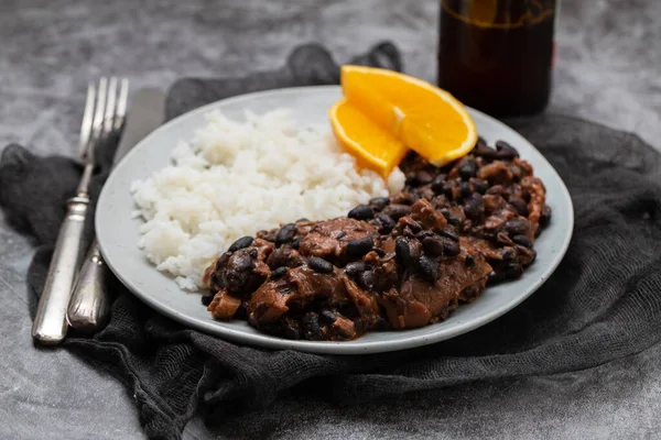 Feijoada typical Brazilian food. Traditional Brazilian food made with black beans in plate