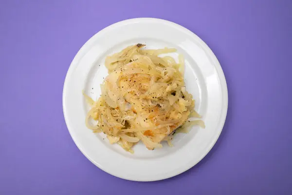 Traditional portuguese cousine, cod fish onions with olive oil.