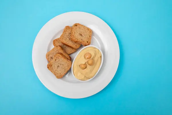 Skål Hummus Dopp Med Mini Rostat Bröd Vit Platta Stockfoto