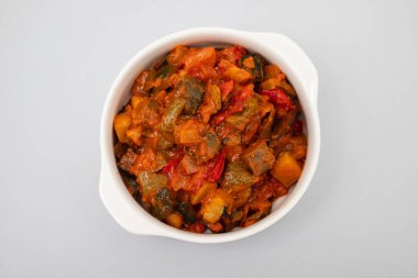 gourmet ratatouille in a white small bowl. clipart