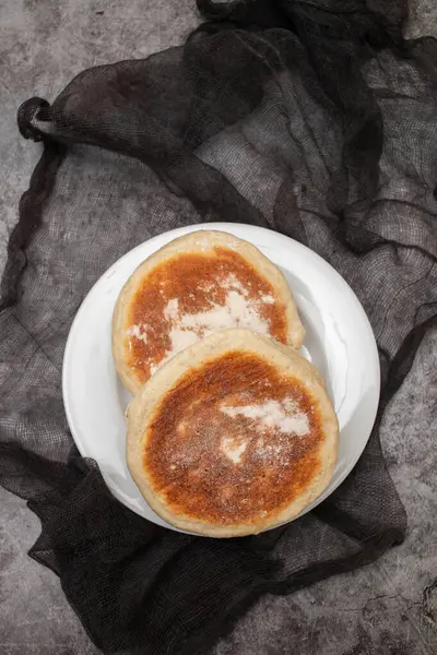 stock image Traditional bread, Bolo do caco, Madeira on the white small plate