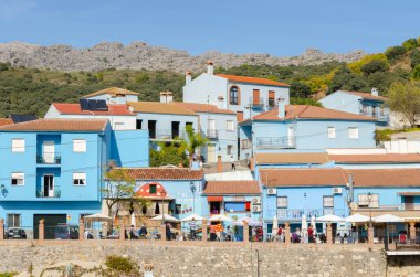 JUZCAR, SPAIN - 20 NOVEMBER 2022 Blue village better known as the city of smurfs, is the architecture of one of the most beautiful cities in Andalusia