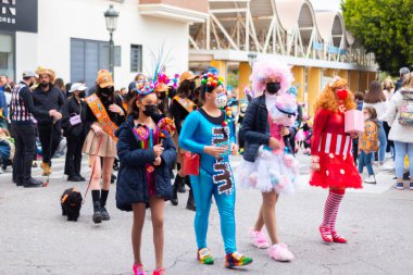 NERJA, SPAIN - 27 FEBRUARY 2022 A carnival parade that parodies a funeral procession and ends with the burning of a symbolic sardine figure