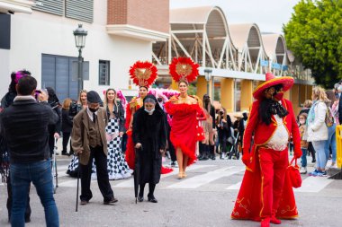 NERJA, SPAIN - 27 FEBRUARY 2022 A carnival parade that parodies a funeral procession and ends with the burning of a symbolic sardine figure