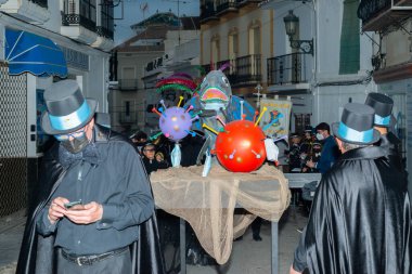 NERJA, SPAIN - 27 FEBRUARY 2022 A carnival parade that parodies a funeral procession and ends with the burning of a symbolic sardine figure