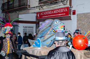 NERJA, SPAIN - 27 FEBRUARY 2022 A carnival parade that parodies a funeral procession and ends with the burning of a symbolic sardine figure