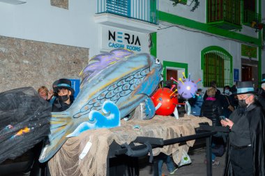 NERJA, SPAIN - 27 FEBRUARY 2022 A carnival parade that parodies a funeral procession and ends with the burning of a symbolic sardine figure