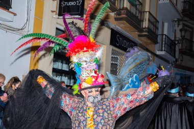 NERJA, SPAIN - 27 FEBRUARY 2022 A carnival parade that parodies a funeral procession and ends with the burning of a symbolic sardine figure