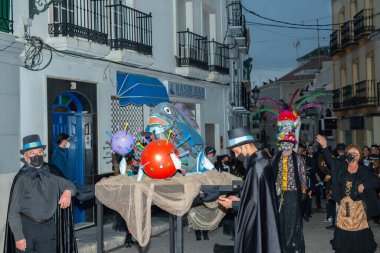 NERJA, SPAIN - 27 FEBRUARY 2022 A carnival parade that parodies a funeral procession and ends with the burning of a symbolic sardine figure