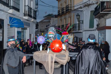 NERJA, SPAIN - 27 FEBRUARY 2022 A carnival parade that parodies a funeral procession and ends with the burning of a symbolic sardine figure