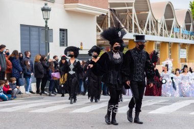 NERJA, SPAIN - 27 FEBRUARY 2022 A carnival parade that parodies a funeral procession and ends with the burning of a symbolic sardine figure