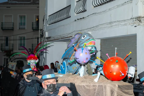 NERJA, SPAIN - 27 FEBRUARY 2022 A carnival parade that parodies a funeral procession and ends with the burning of a symbolic sardine figure