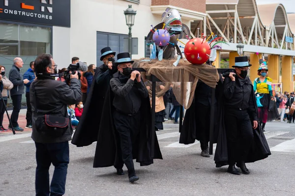 NERJA, SPAIN - 27 FEBRUARY 2022 A carnival parade that parodies a funeral procession and ends with the burning of a symbolic sardine figure