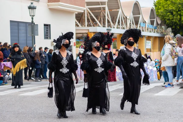 NERJA, SPAIN - 27 FEBRUARY 2022 A carnival parade that parodies a funeral procession and ends with the burning of a symbolic sardine figure