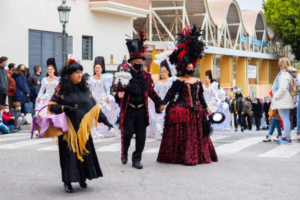 NERJA, SPAIN - 27 FEBRUARY 2022 A carnival parade that parodies a funeral procession and ends with the burning of a symbolic sardine figure